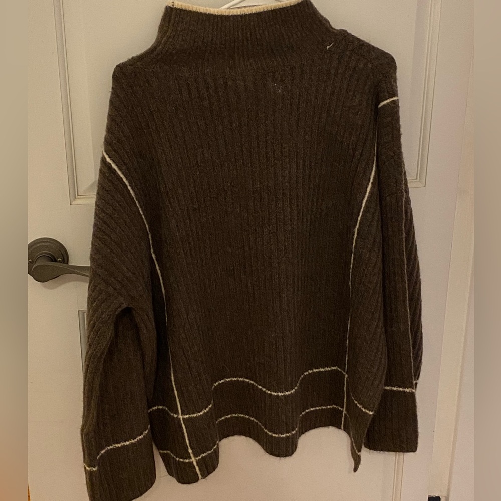 Brown warm top with white stripes.